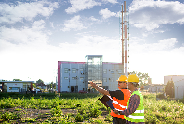 Workers discussing plans